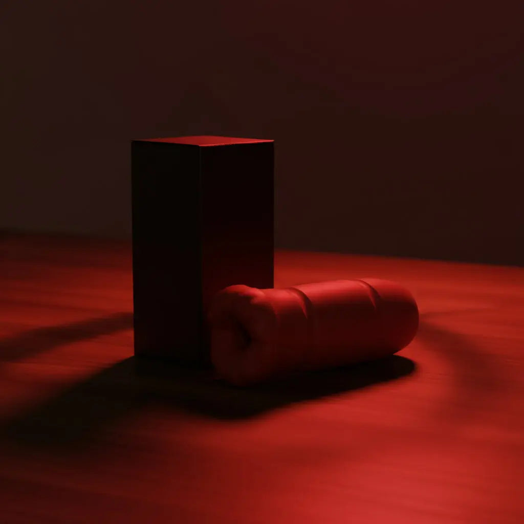 Red silicone product with a black box on a white background